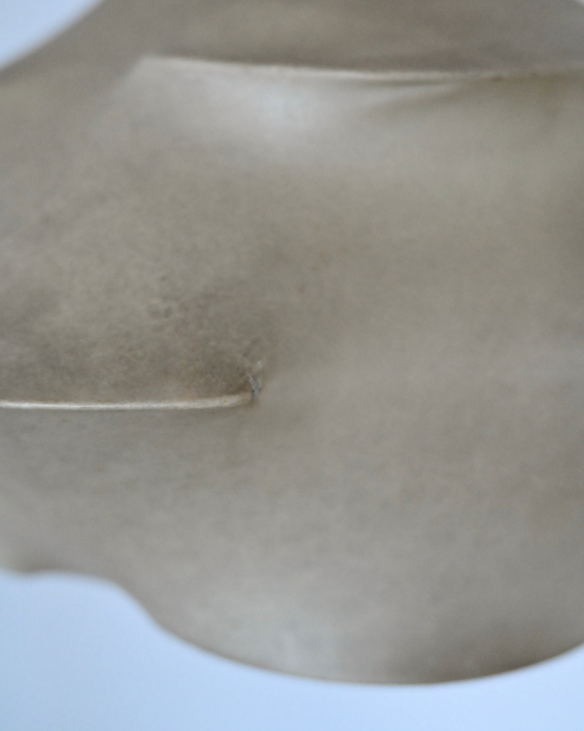 Close-up of Cocoon resin shade and steel frame